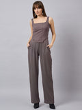 Brown corset top with flared jeans