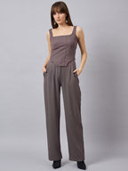 Brown corset top with flared jeans