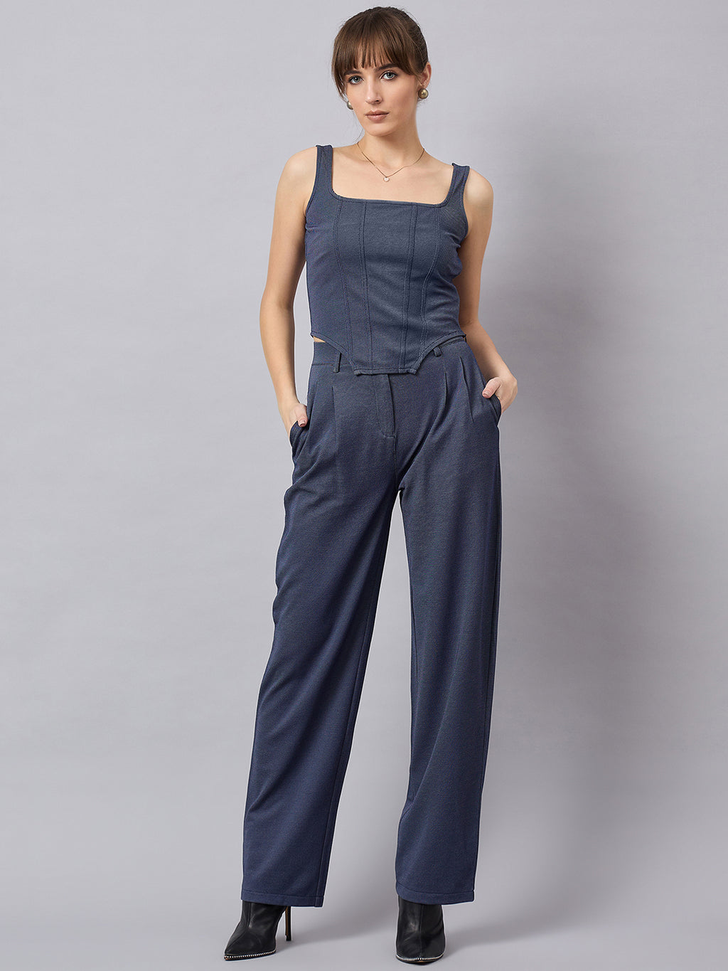 Blue corset top with flared jeans