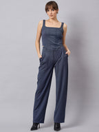 Blue corset top with flared jeans