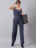 Blue corset top with flared jeans