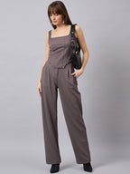 Brown corset top with flared jeans