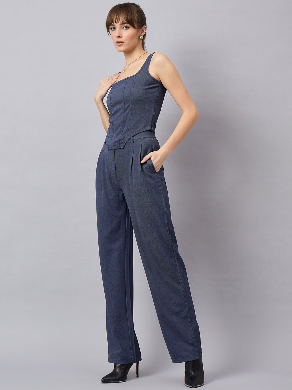 Blue corset top with flared jeans