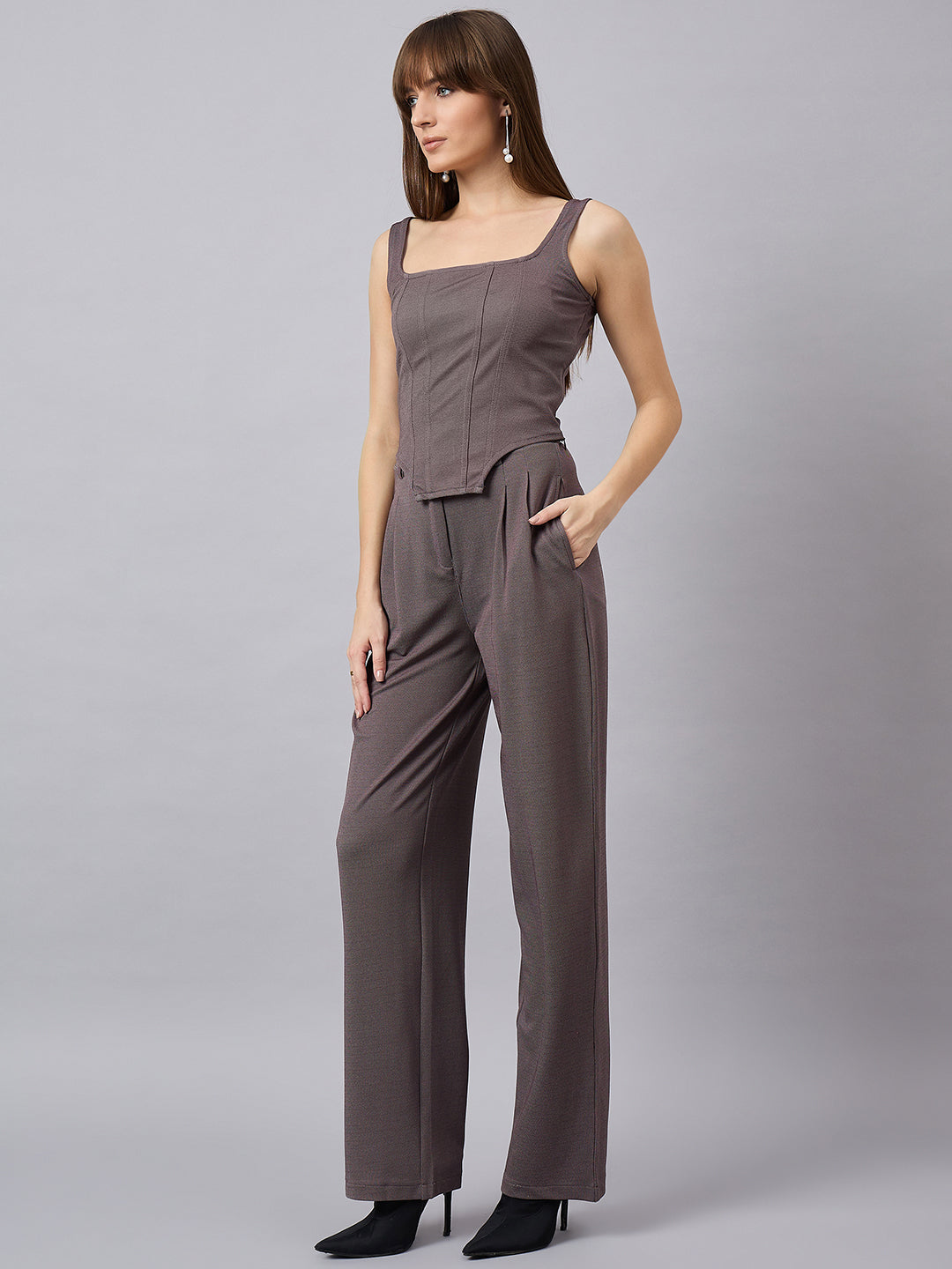 Brown corset top with flared jeans