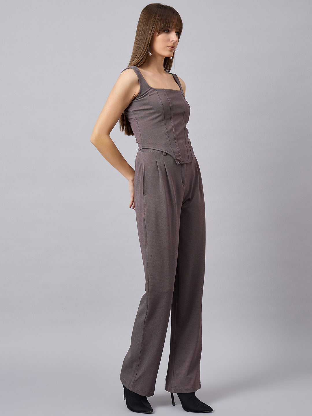 Brown corset top with flared jeans