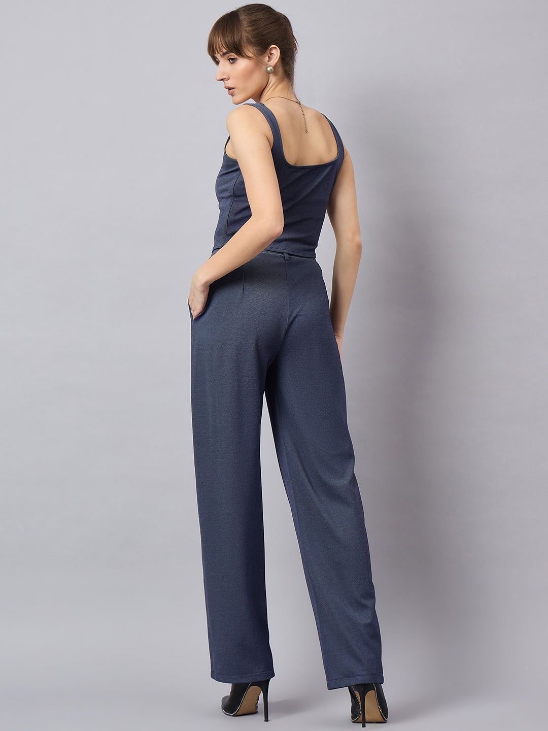 Blue corset top with flared jeans