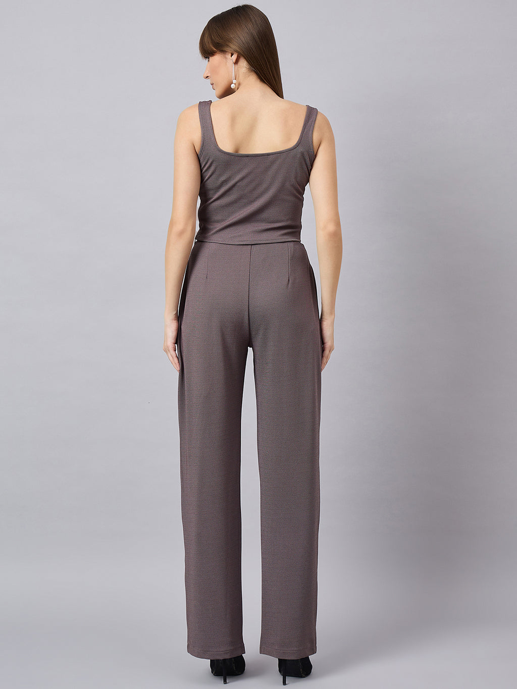 Brown corset top with flared jeans