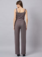 Brown corset top with flared jeans